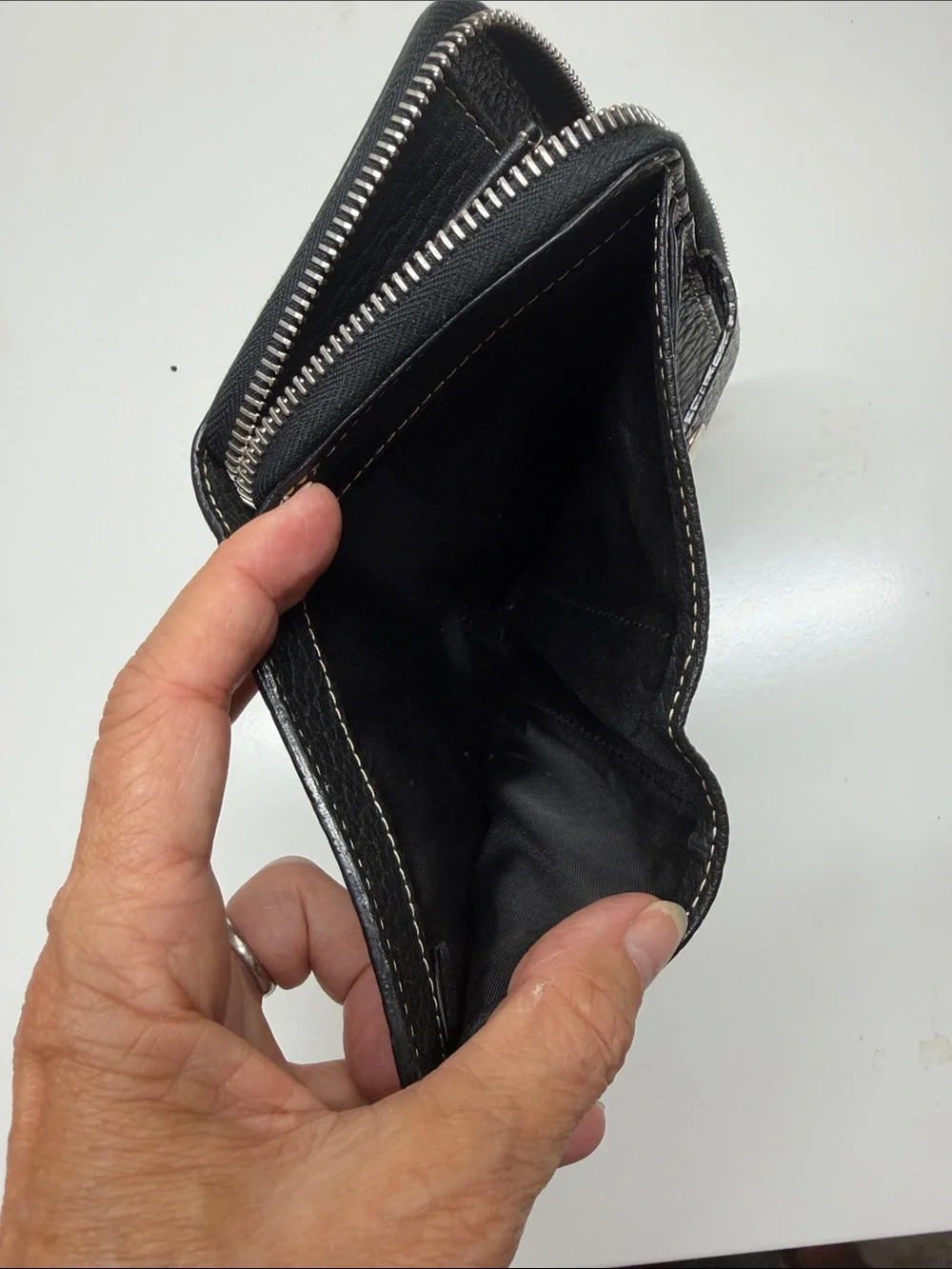 Dooney & Burke Black pebbled Leather Zip Wallet